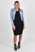 Load image into Gallery viewer, Our Frayed Denim Jacket is perfect for all seasons, made of soft and stretchy denim with a cropped hem for easy layering and all-year wear. The jacket is super stylish with a frayed hem and washed appearance, yet functional with breast and hip pockets, and a split cuff for adjusting the sleeve length. PQ Collection. Front view of denim jacket
