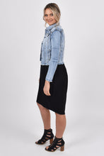 Load image into Gallery viewer, Our Frayed Denim Jacket is perfect for all seasons, made of soft and stretchy denim with a cropped hem for easy layering and all-year wear. The jacket is super stylish with a frayed hem and washed appearance, yet functional with breast and hip pockets, and a split cuff for adjusting the sleeve length. PQ Collection. Side view

