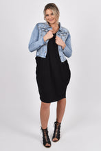Load image into Gallery viewer, Our Frayed Denim Jacket is perfect for all seasons, made of soft and stretchy denim with a cropped hem for easy layering and all-year wear. The jacket is super stylish with a frayed hem and washed appearance, yet functional with breast and hip pockets, and a split cuff for adjusting the sleeve length. PQ Collection. Unbuttoned front view
